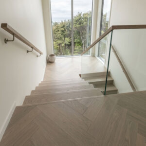 Linen Oak Herringbone showcases the understated beauty of European Oak in a soft, contemporary tone inspired by natural linen fabrics and weathered coastal landscapes.