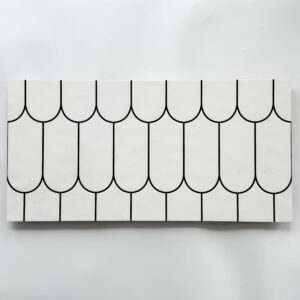 The GRC6L329 300x600mm ceramic wall tile introduces a refreshing, modern twist on classic scale-pattern geometry.With its clean white background and bold black arched lines.