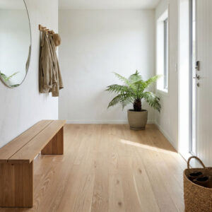 Exquisite natural white brushed oak engineered wood flooring is characterised by its refined surface finish and carefully layered colour treatment.