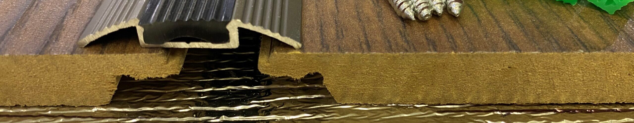 Flat champagne transition trim We are a trusted supplier of both wooden and aluminum flooring accessories, offering a wide range of products with extensive stock available for quick and hassle-free ordering.